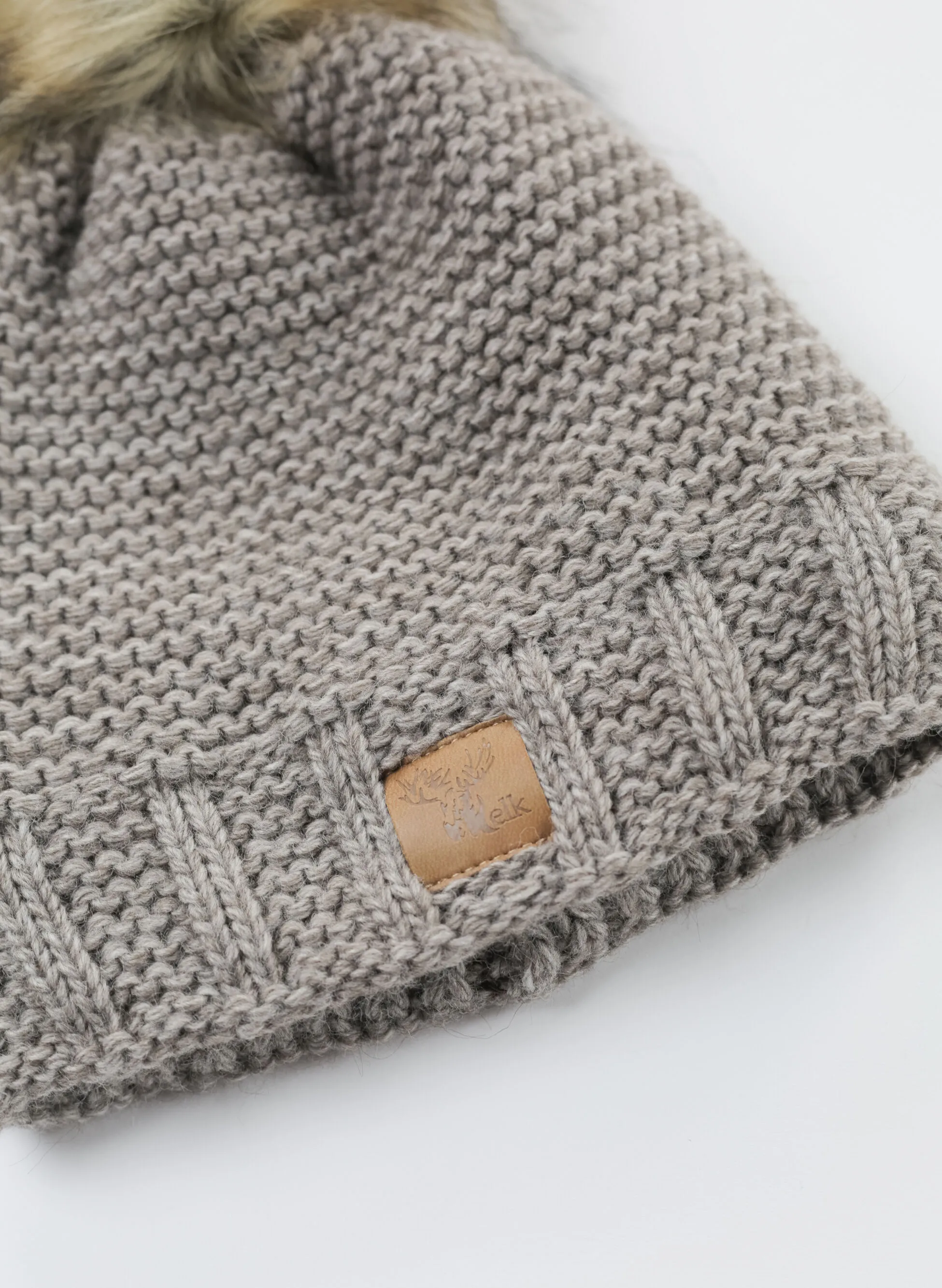 cappello ponpon pelo