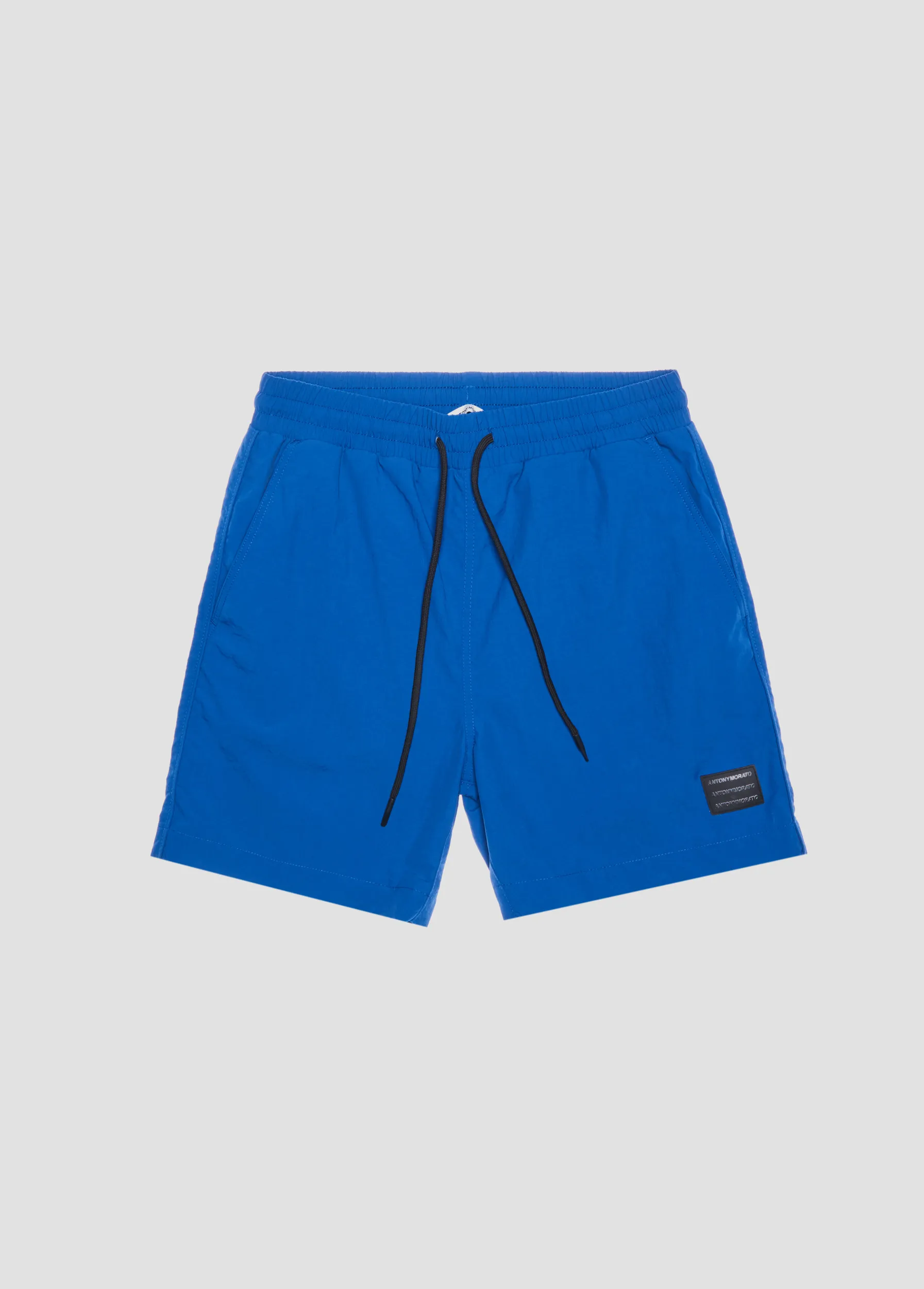 COSTUME REGULAR FIT IN TESSUTO TECNICO CON PATCH LOGATA