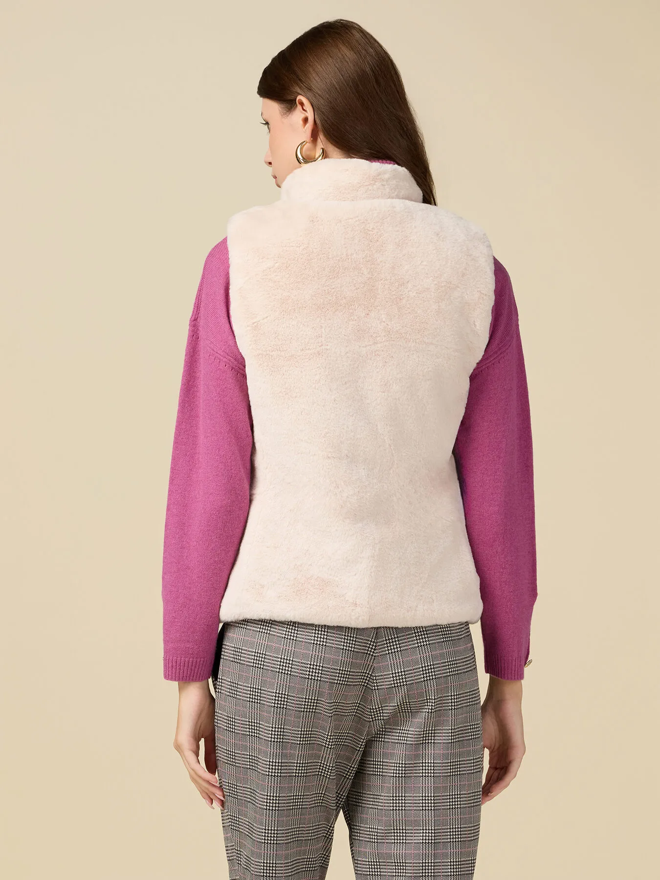 Piumino smanicato reversibile